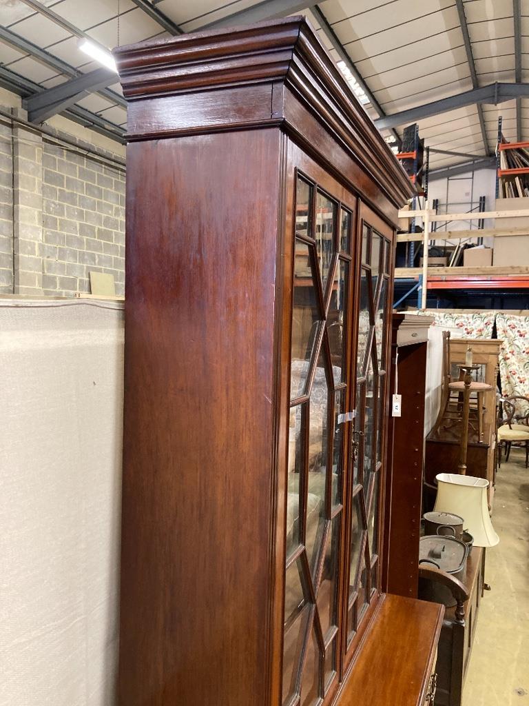 A Victorian mahogany bookcase cupboard, length 106cm, depth 47cm, height 222cm